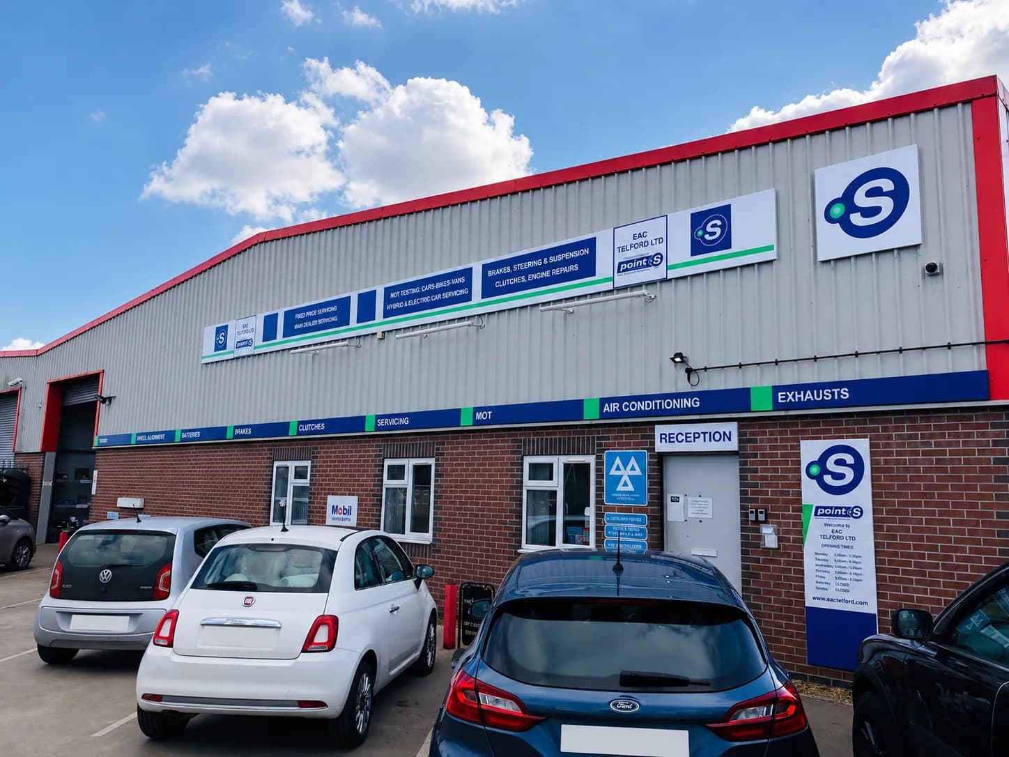 EAC Telford garage exterior with customer cars parked outside reception