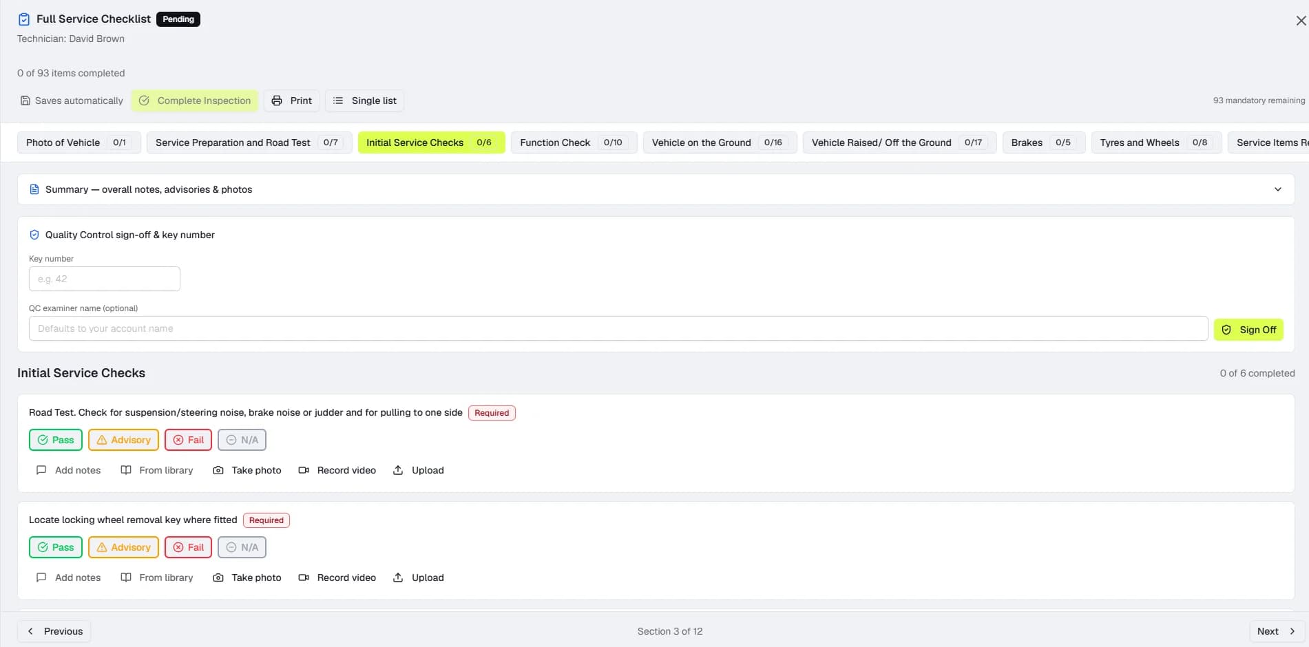 A technician's vehicle health check in BOOKAR — checklist sections with pass, advisory and fail buttons and photo and video capture on each item