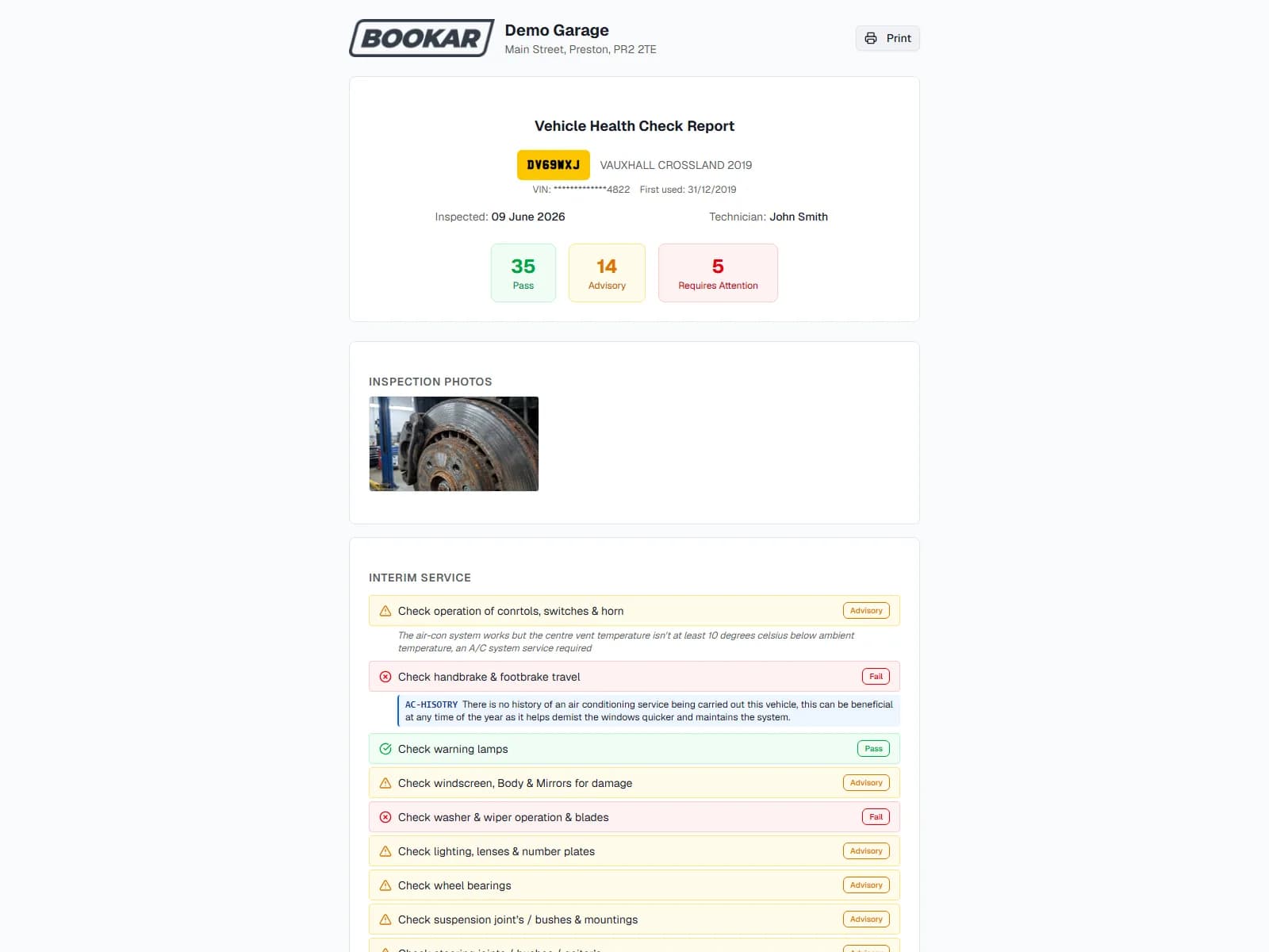 A vehicle health check report with the inspection photo of a worn brake disc